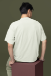 mockup-featuring-a-man-wearing-an-oversized-round-neck-tee-in-a-studio-m38923-1.png